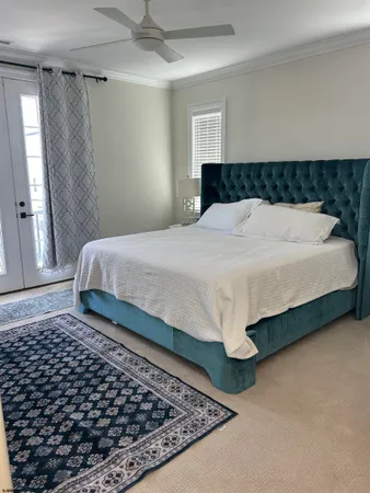 a bedroom with a bed and window