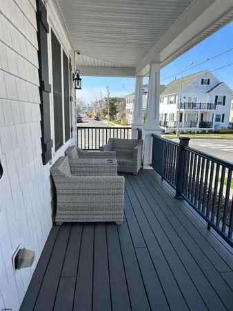 a view of a balcony with wooden floor