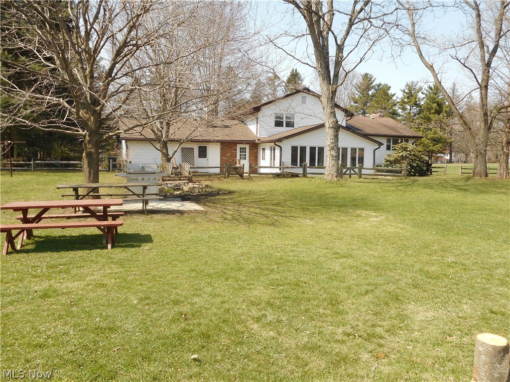 12685 Heath Road Chesterland, OH 44026 - Photo 5 of 25 View of the Back of the House. Big backyard with Fenced Garden Spaces, a Water Feature and small barn!