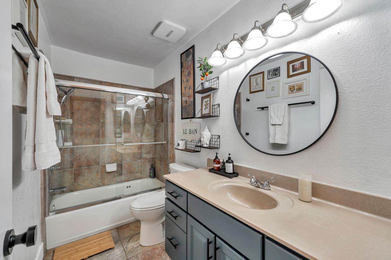470 Corte Cabanil Morgan Hill, CA 95037 - Photo 22 of 41 a bathroom with a toilet a sink and a mirror