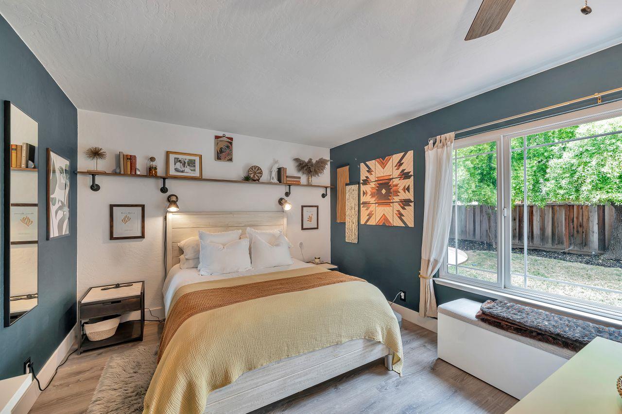 470 Corte Cabanil Morgan Hill, CA 95037 - Photo 25 of 41 a bedroom with a large bed and a balcony