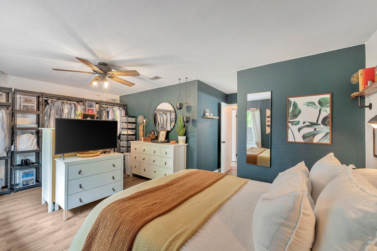 470 Corte Cabanil Morgan Hill, CA 95037 - Photo 27 of 41 a bedroom with a bed and a flat tv screen on dresser