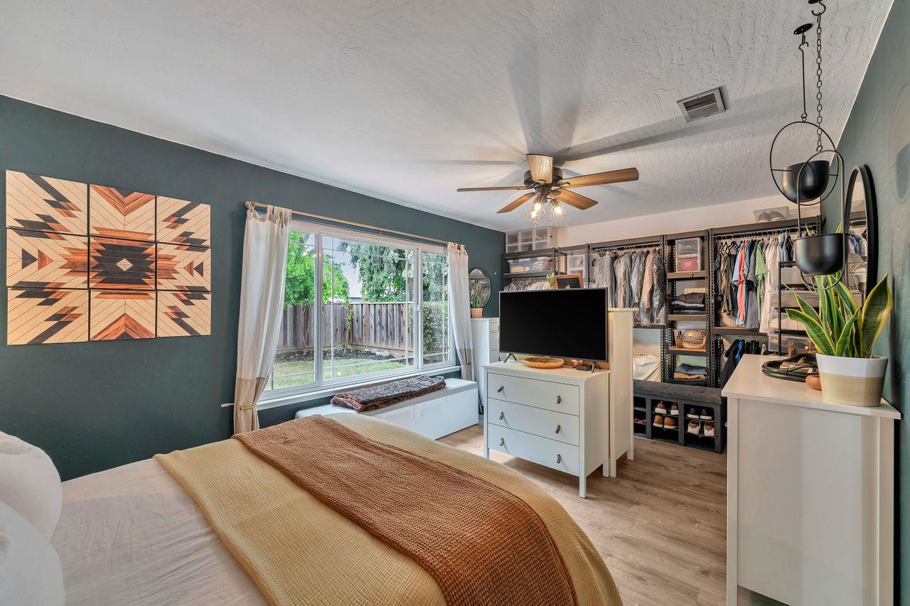 470 Corte Cabanil Morgan Hill, CA 95037 - Photo 28 of 41 a bedroom with furniture and a flat screen tv