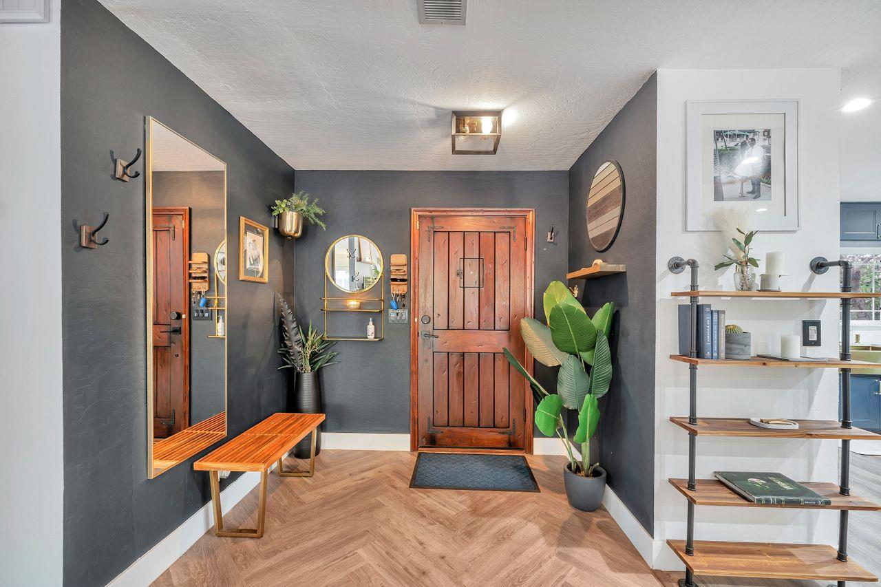 470 Corte Cabanil Morgan Hill, CA 95037 - Photo 6 of 41 a room with furniture a rug and a chandelier