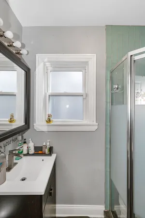 a bathroom with a sink and a mirror