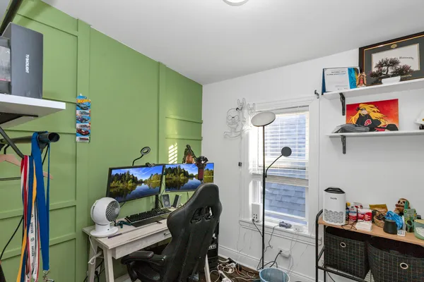 a room with furniture and a potted plant