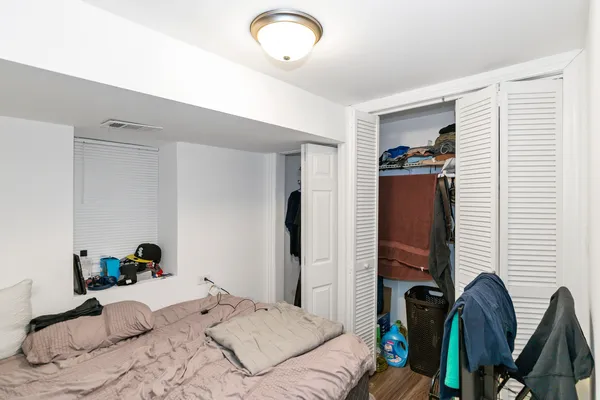 a bedroom with a bed and furniture