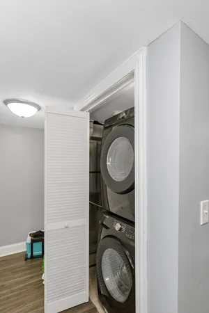 a view of a hallway with washer and dryer