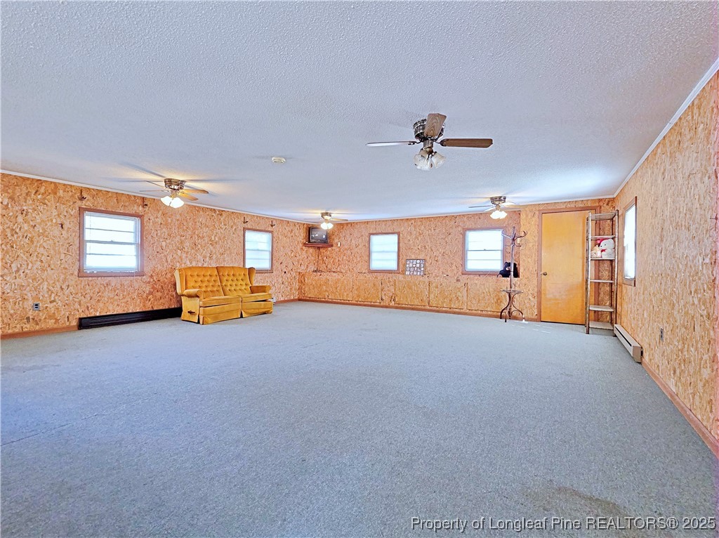 764 Old Vander Road Fayetteville, NC 28312 - Photo 34 of 50 a living room with furniture and a chandelier