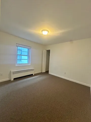 a kitchen with cabinets and white stainless steel appliances
