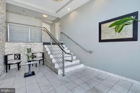 a view of entryway livingroom and hall