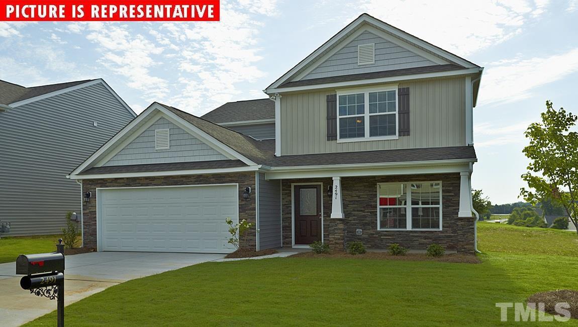 3609 Marble Ridge Lane Raleigh, NC 27610 - Photo 1 of 1 a front view of a house with a garden and yard