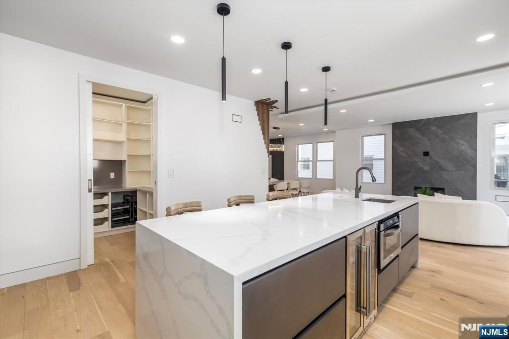33 Elycroft Parkway Rutherford, NJ 07070 - Photo 12 of 46 a large kitchen with kitchen island a stove a sink a center island a stove a table and chairs