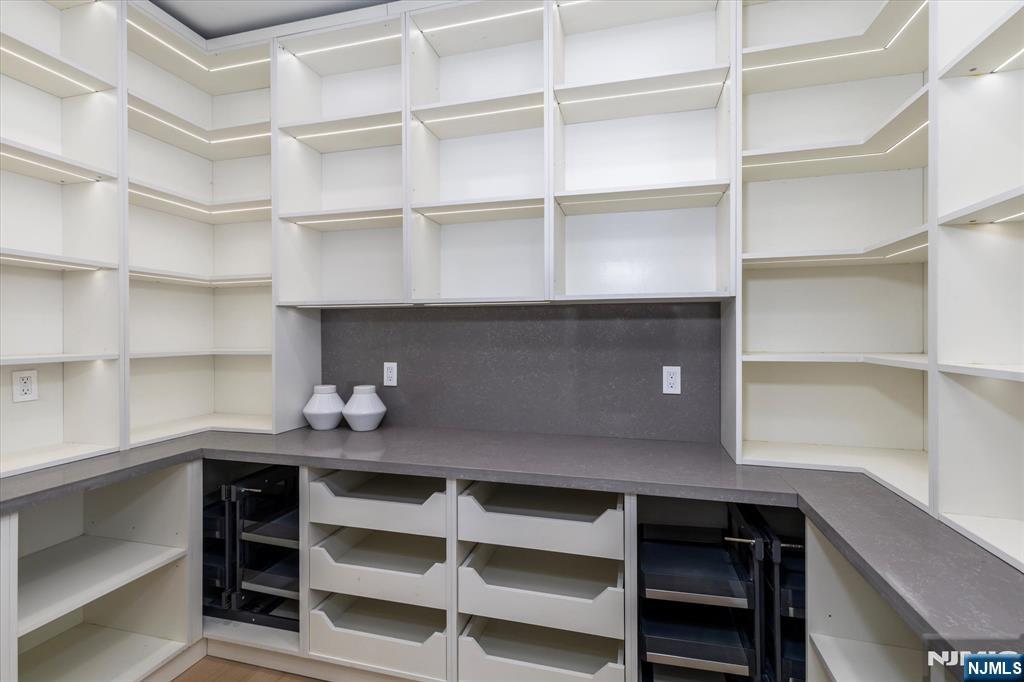 33 Elycroft Parkway Rutherford, NJ 07070 - Photo 13 of 46 a room with a desk and a book shelf