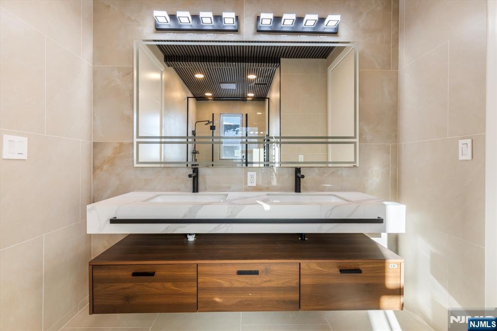 33 Elycroft Parkway Rutherford, NJ 07070 - Photo 21 of 46 a bathroom with a sink and a mirror