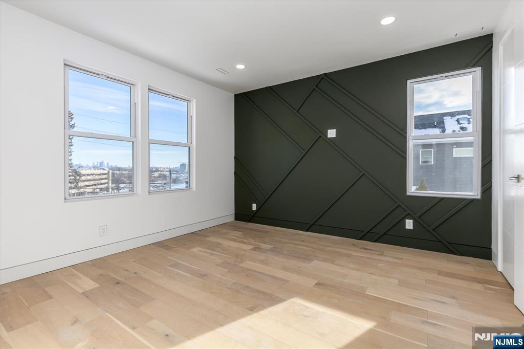 33 Elycroft Parkway Rutherford, NJ 07070 - Photo 22 of 46 a bedroom with a bed and a window
