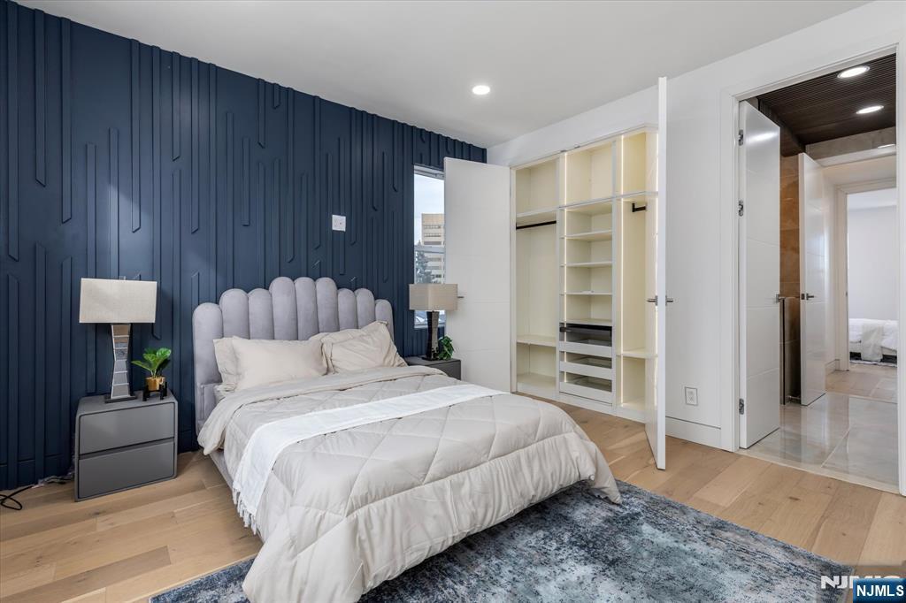 33 Elycroft Parkway Rutherford, NJ 07070 - Photo 28 of 46 a bed room with a bed and a lamp