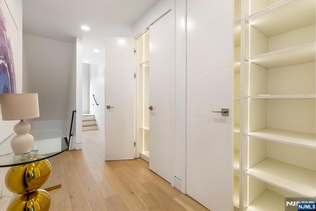 33 Elycroft Parkway Rutherford, NJ 07070 - Photo 29 of 46 a view of a hallway with bathroom and wooden floor