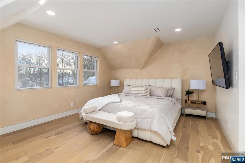 33 Elycroft Parkway Rutherford, NJ 07070 - Photo 30 of 46 a bedroom with a bed and wooden floor