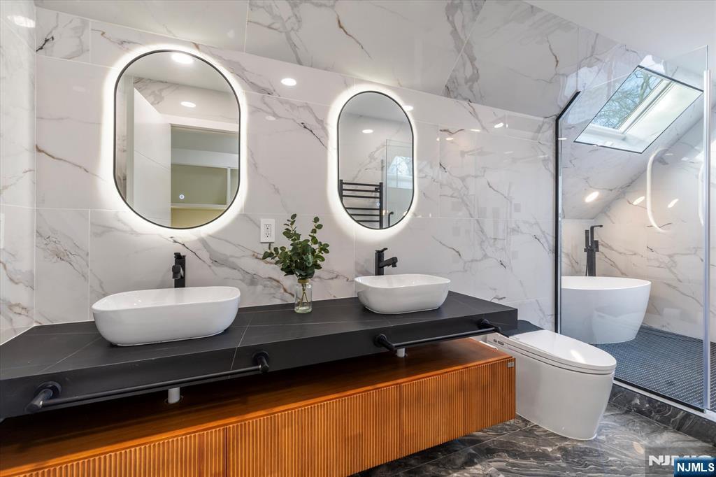 33 Elycroft Parkway Rutherford, NJ 07070 - Photo 34 of 46 a bathroom with a toilet sink and mirror