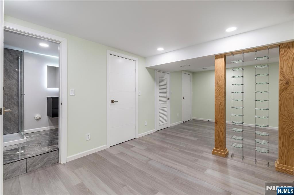 33 Elycroft Parkway Rutherford, NJ 07070 - Photo 39 of 46 an empty room with wooden floor and way to kitchen