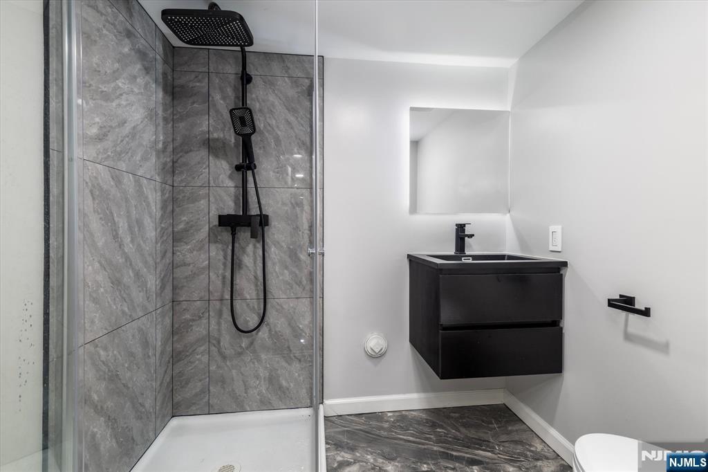 33 Elycroft Parkway Rutherford, NJ 07070 - Photo 40 of 46 a bathroom with a shower and toilet