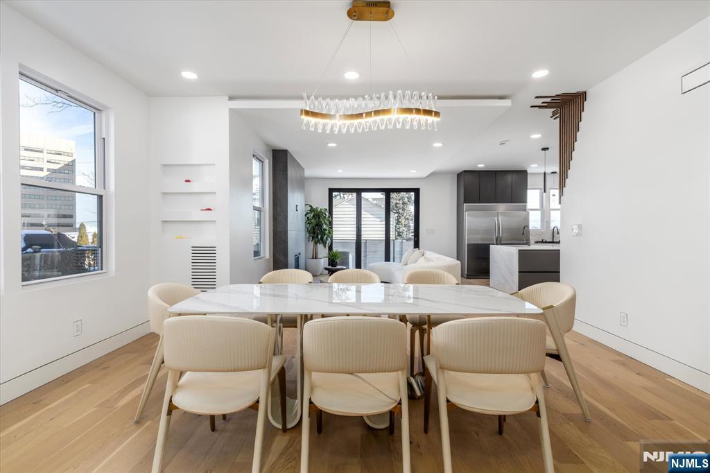 33 Elycroft Parkway Rutherford, NJ 07070 - Photo 5 of 46 a view of a dining room with furniture and wooden floor