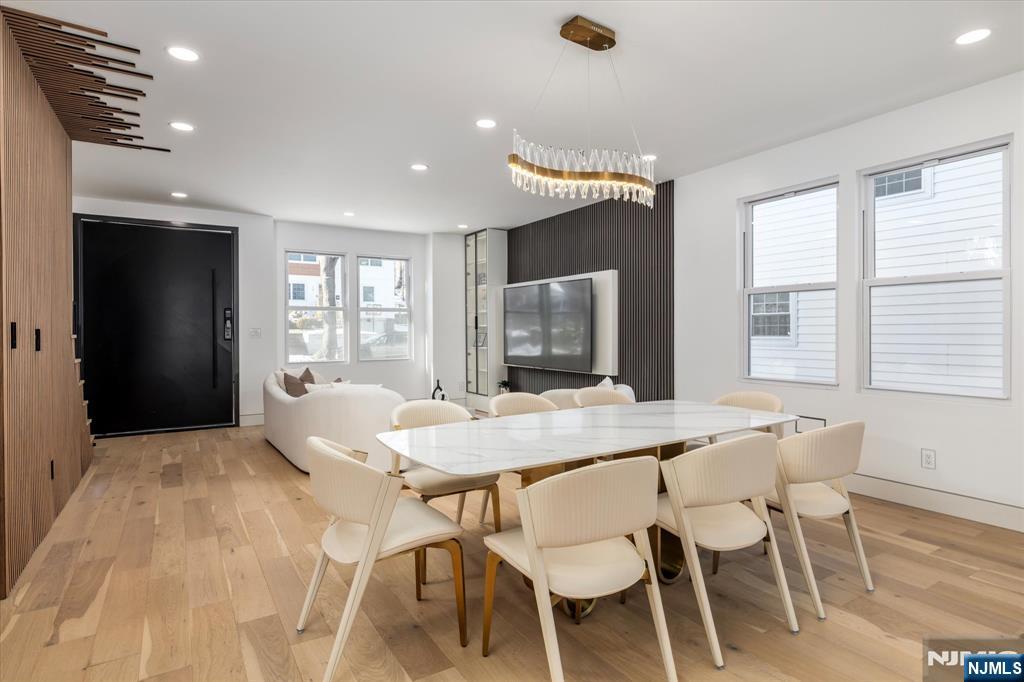 33 Elycroft Parkway Rutherford, NJ 07070 - Photo 6 of 46 a view of a dining room with furniture window and wooden floor