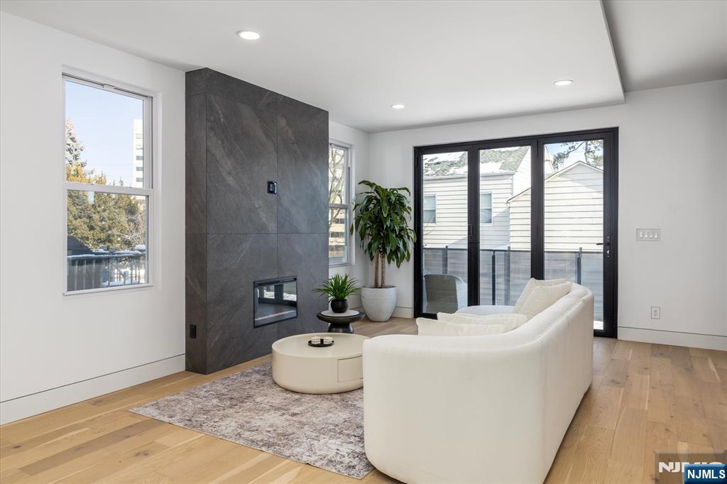 33 Elycroft Parkway Rutherford, NJ 07070 - Photo 7 of 46 a living room with furniture and a large window