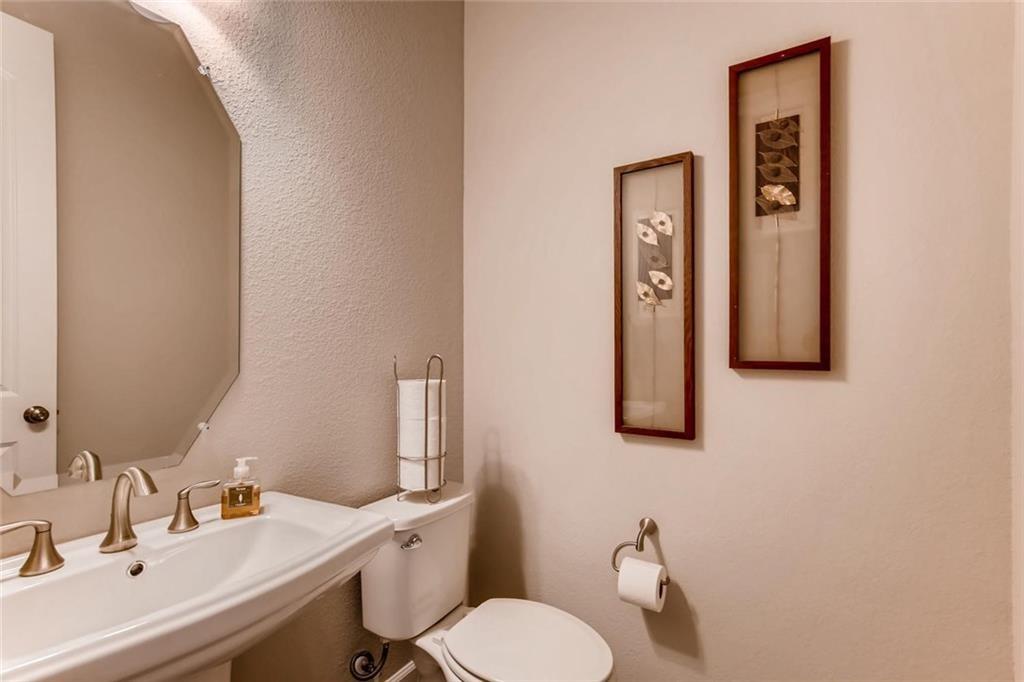 3124 Pablo Way Round Rock, TX 78665 - Photo 13 of 25 a bathroom with a toilet sink and mirror