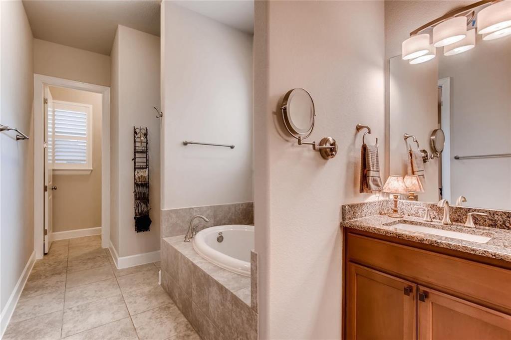 3124 Pablo Way Round Rock, TX 78665 - Photo 16 of 25 a bathroom with a tub sink and mirror