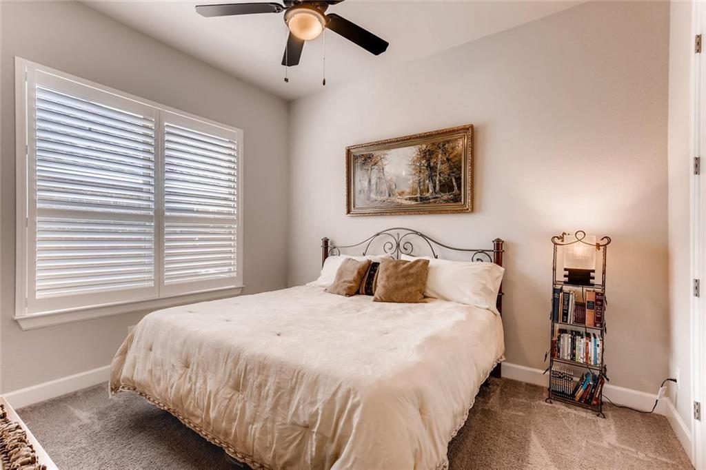 3124 Pablo Way Round Rock, TX 78665 - Photo 18 of 25 a bedroom with a bed and a painting on the wall