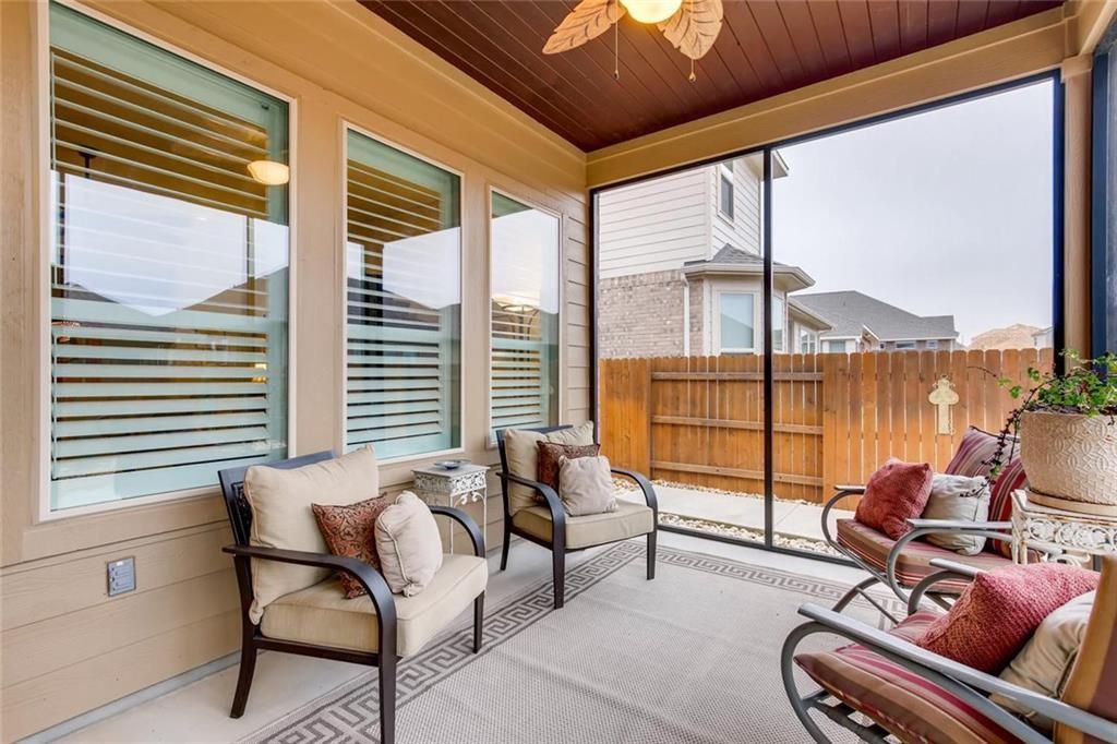 3124 Pablo Way Round Rock, TX 78665 - Photo 23 of 25 a living room with furniture and floor to ceiling windows