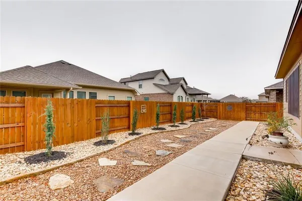 a view of backyard of a house