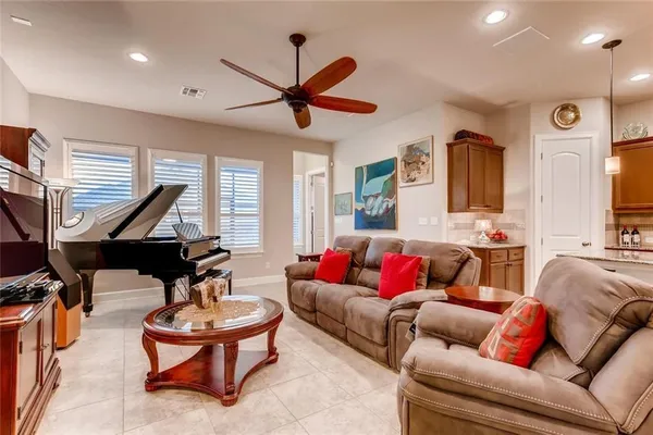 a dining room with furniture and window