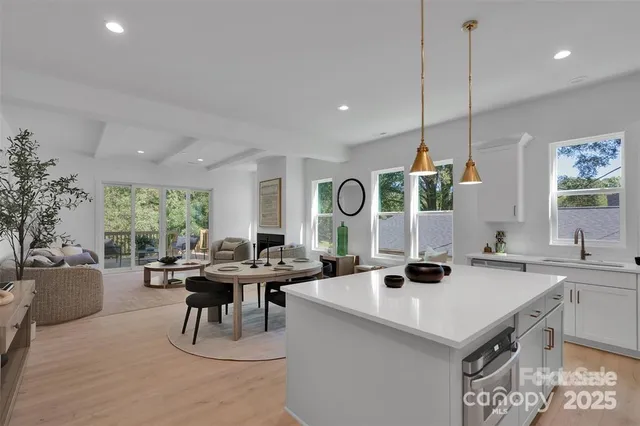 a living room with furniture a window and a clock