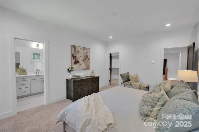 a bedroom with a bed and dresser