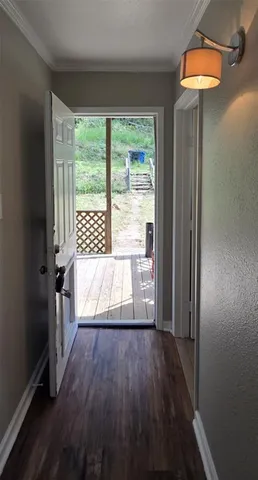 a view of wooden floor and windows in a room