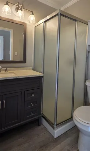 a bathroom with a toilet a sink and a mirror