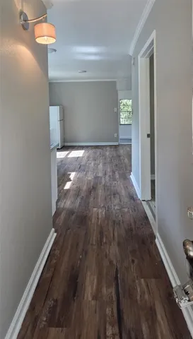 a view of empty room with window and entryway