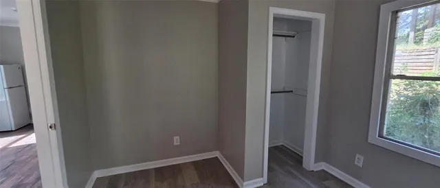 a view of front door with wooden floor