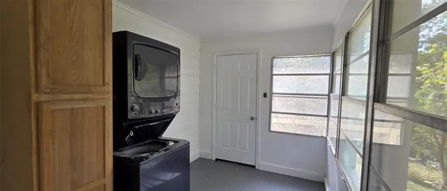 a bathroom with a window and a sink