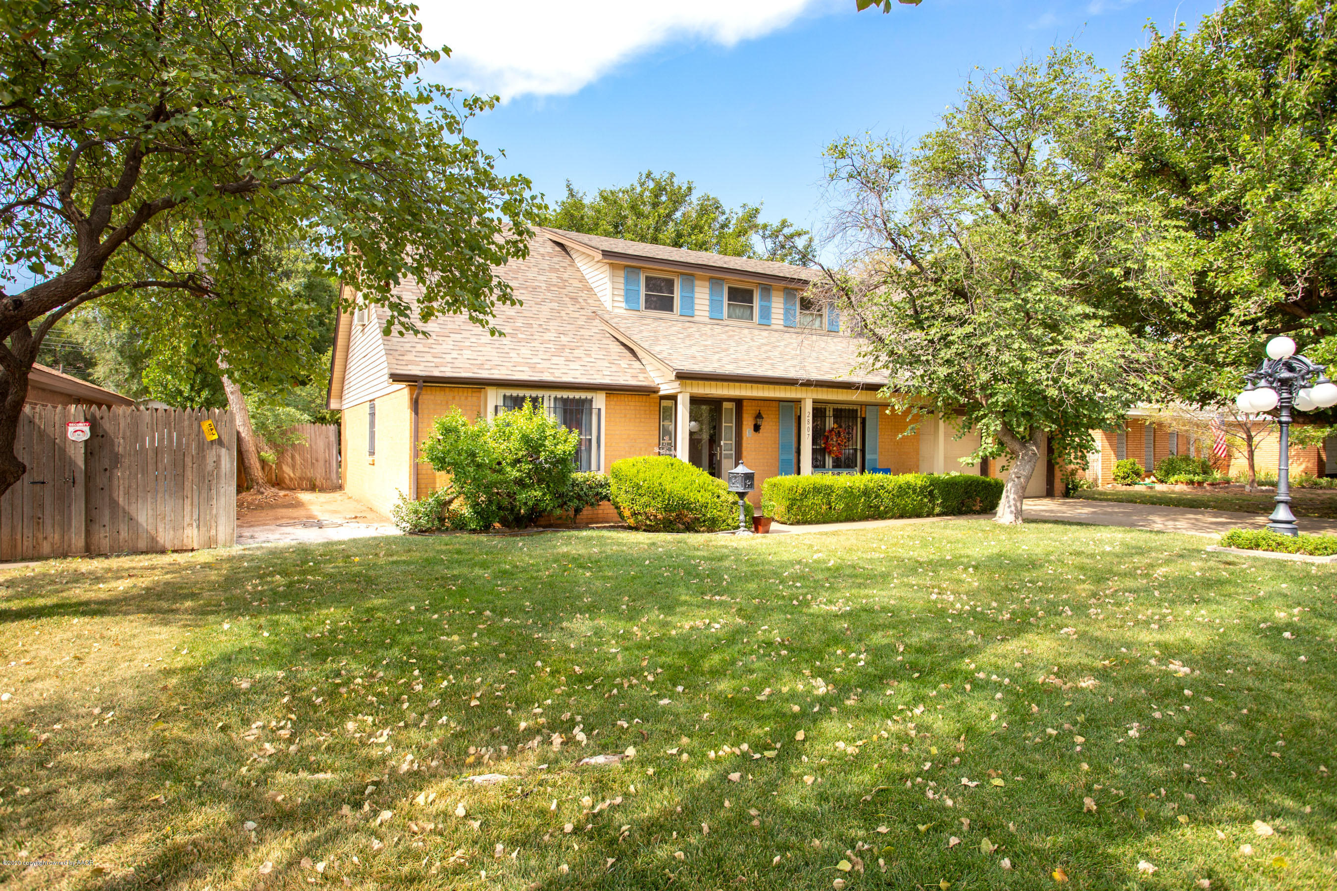 2807 Lloyd Drive Amarillo, TX 79110 - Photo 3 of 32 a front view of a house with a yard