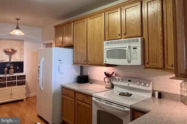 a kitchen with a stove and a microwave
