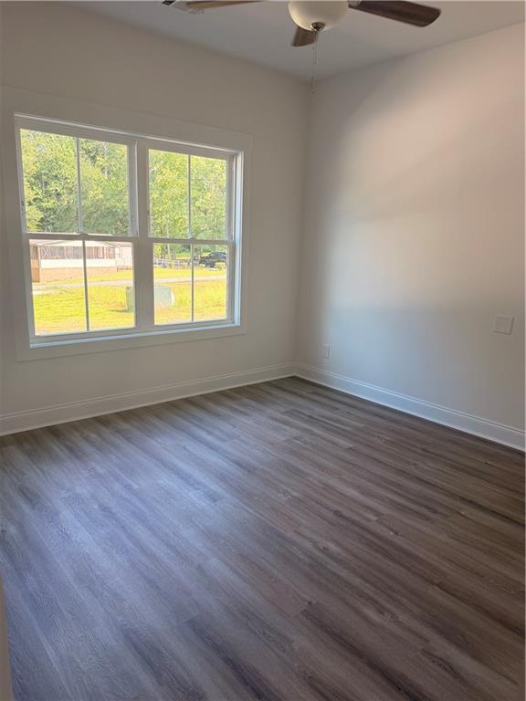 7213 King Road Valley, AL 36854 - Photo 10 of 20 Wood-finish flooring, white trim, dual-pane window, and a ceiling fan