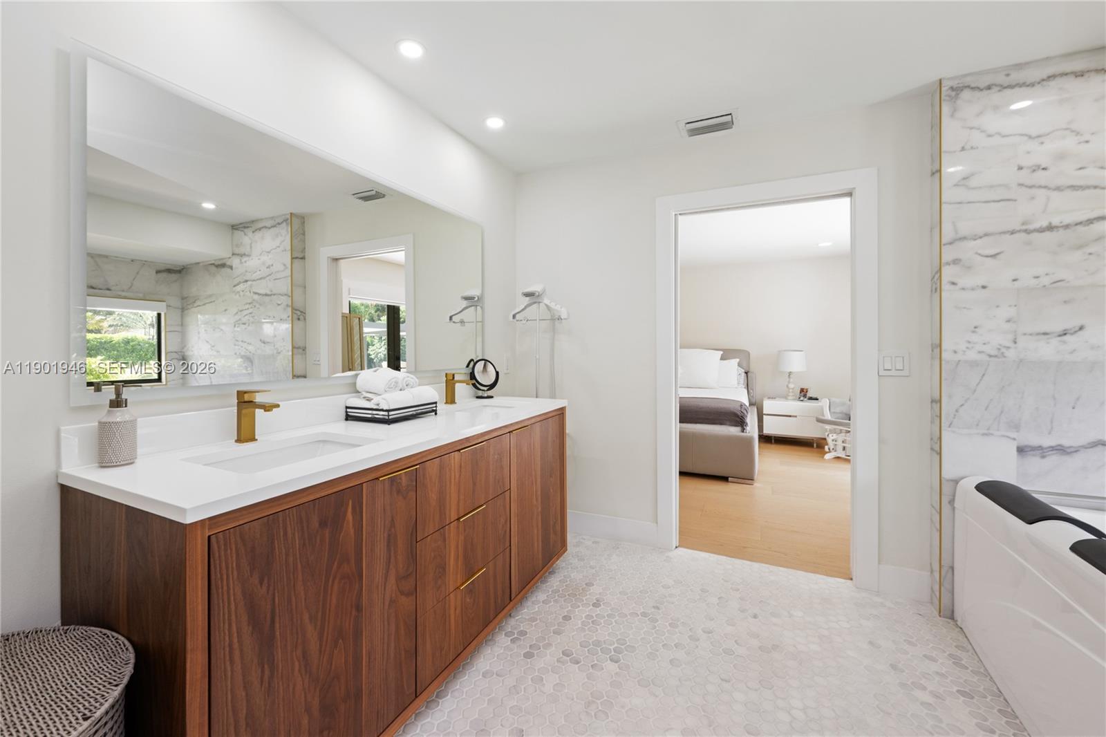 15110 North Saxon Circle Southwest Ranches, FL 33331 - Photo 15 of 45 a bathroom with a sink a toilet and mirror