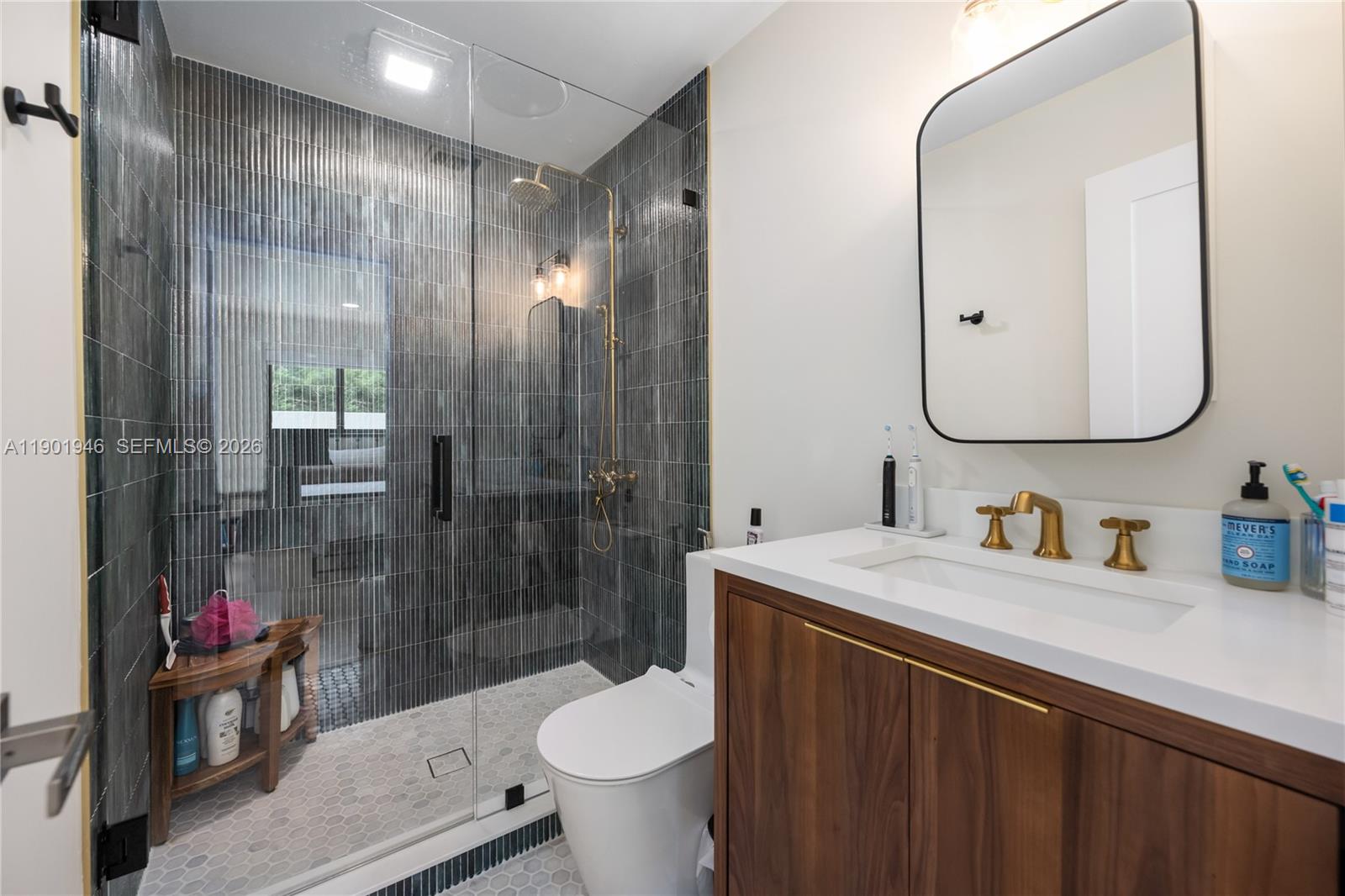 15110 North Saxon Circle Southwest Ranches, FL 33331 - Photo 18 of 45 a bathroom with a sink vanity mirror and toilet