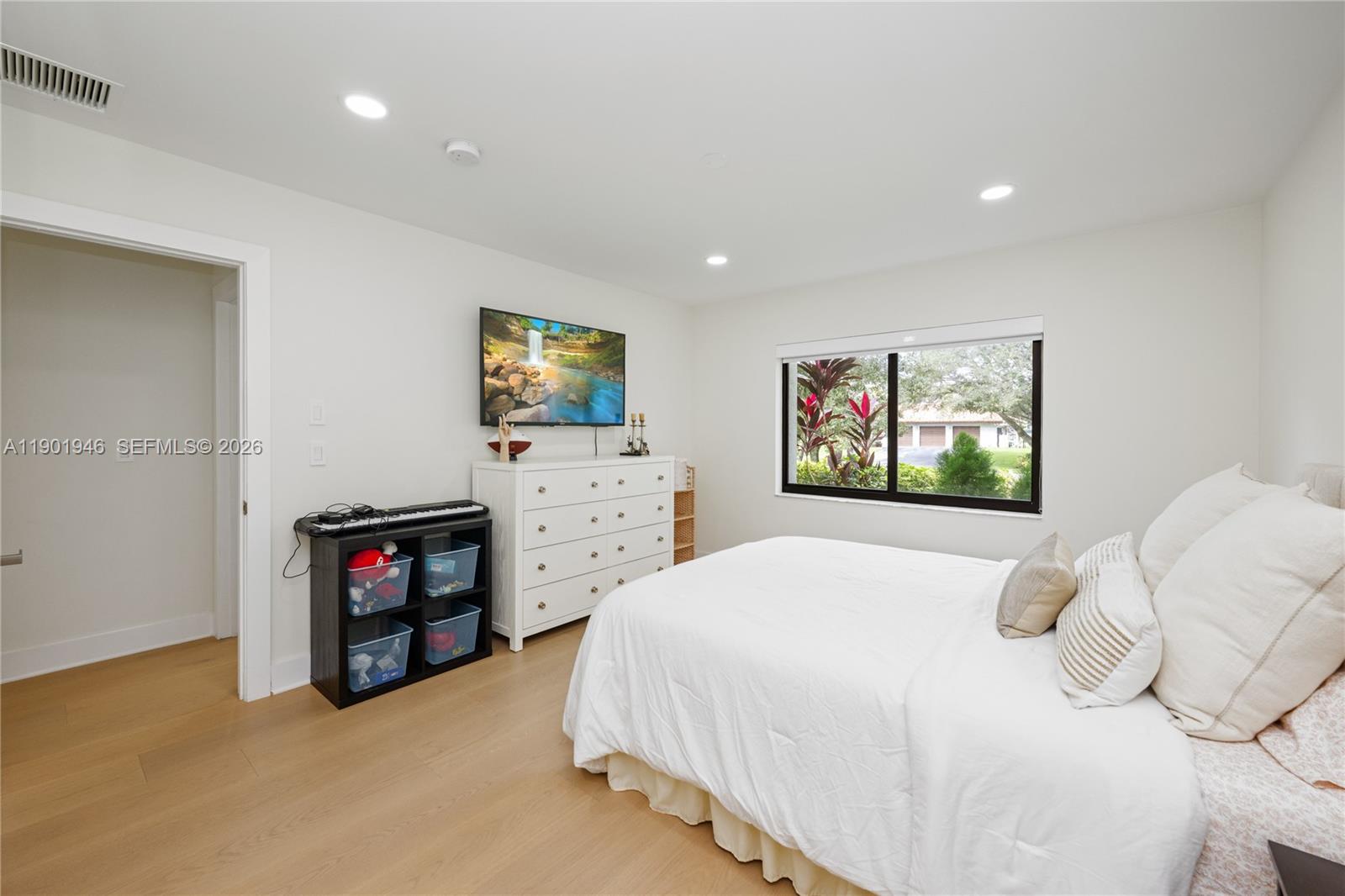 15110 North Saxon Circle Southwest Ranches, FL 33331 - Photo 19 of 45 a bedroom with a bed and a television