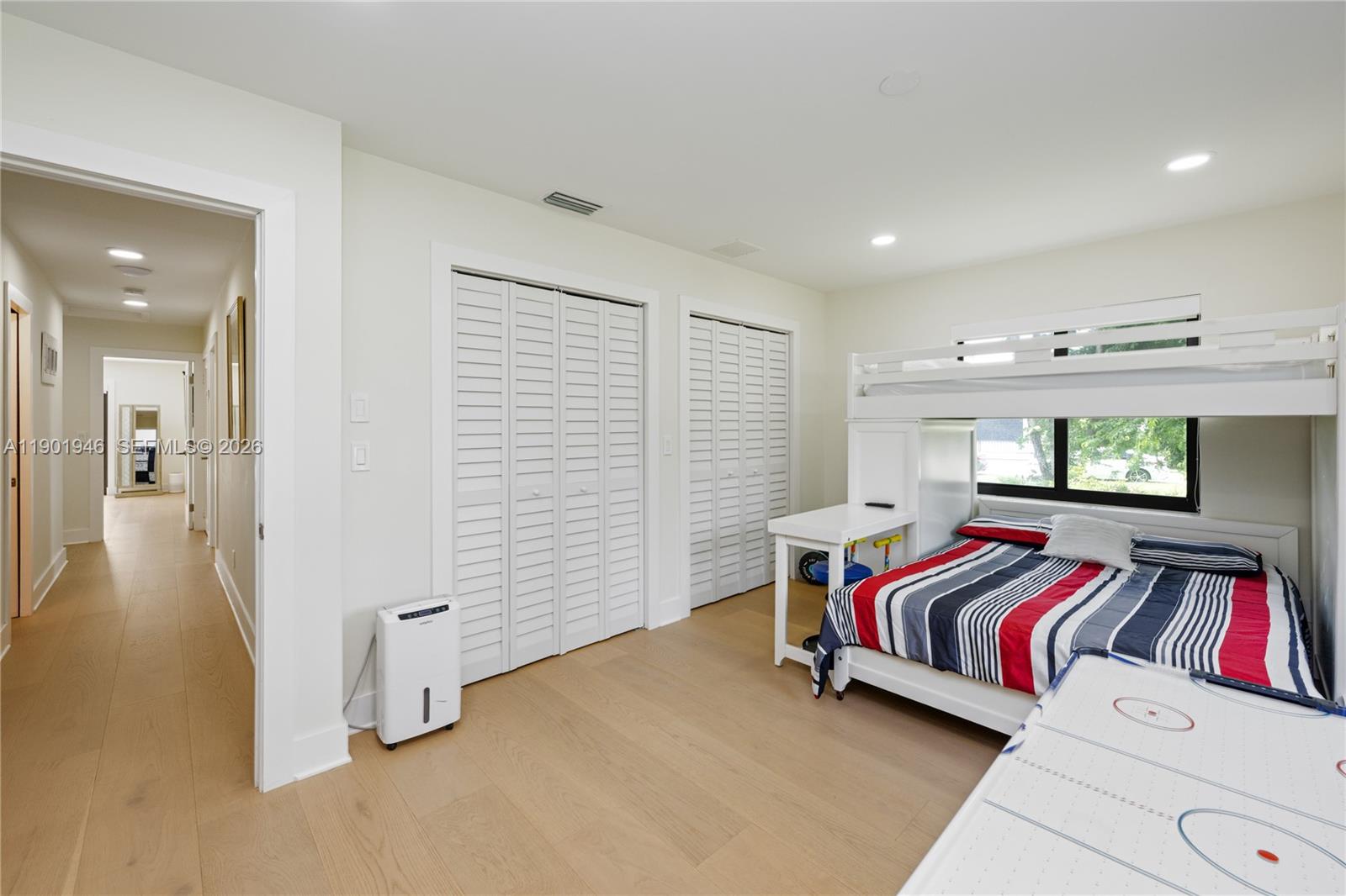 15110 North Saxon Circle Southwest Ranches, FL 33331 - Photo 21 of 45 a bedroom with a bed and a window