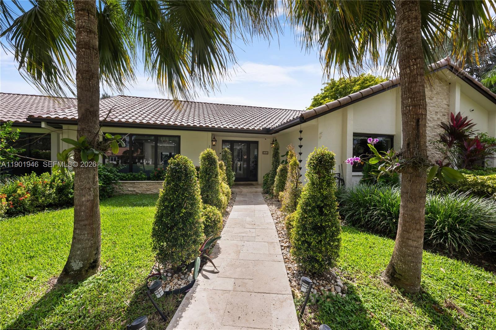 15110 North Saxon Circle Southwest Ranches, FL 33331 - Photo 23 of 45 a front view of house with yard and green space